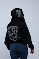 black and pink confidential rhinestone zip up RTM on face